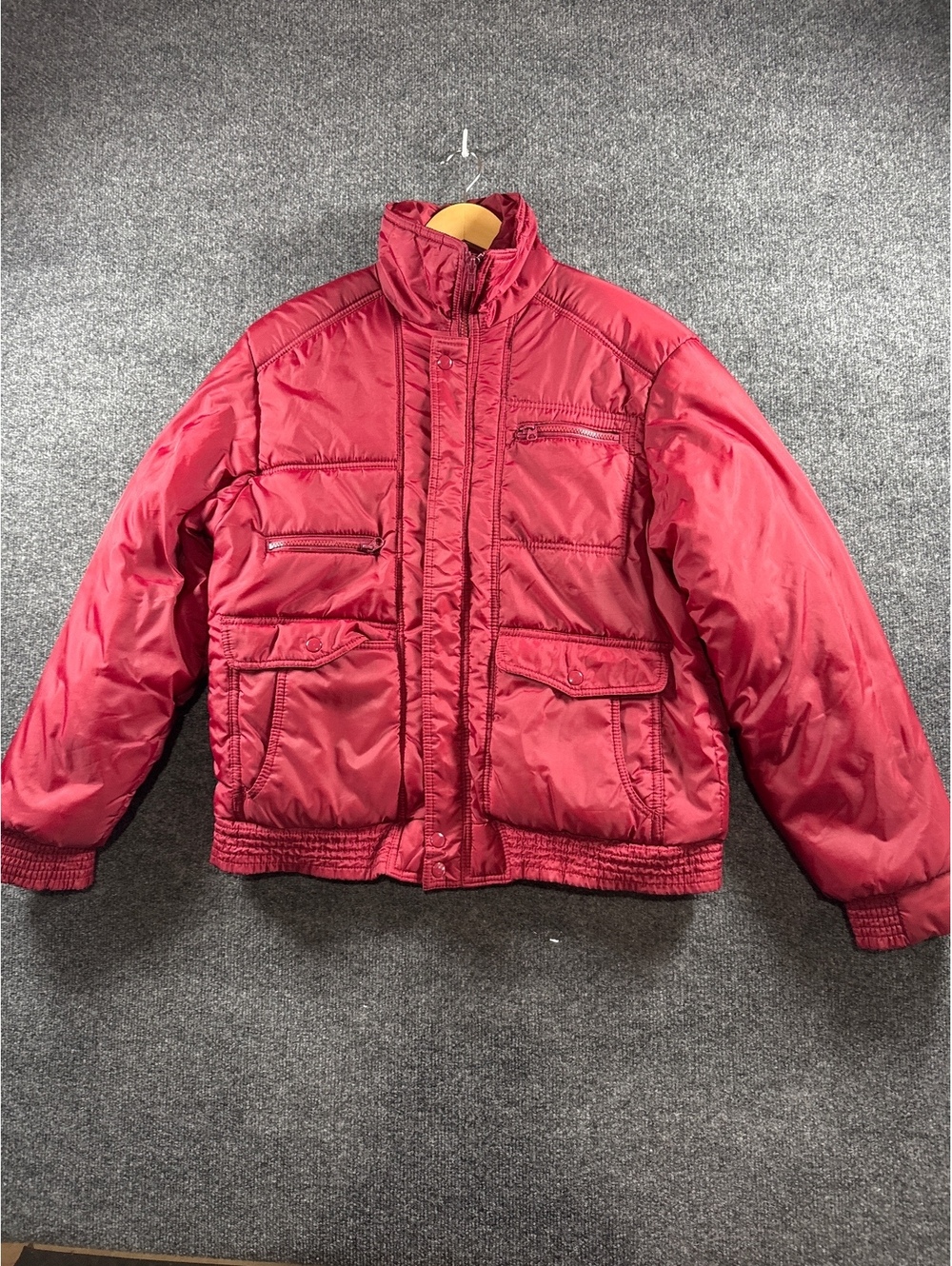 Red Quilted Puffer Jacket with Multiple Pockets and Zip Closure